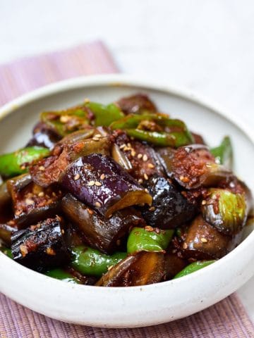 Cubed eggplants with sliced green peppers stir-fried in a gochujang sauce