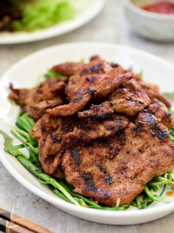 Korean soybean paste marinated pork BBQ served with lettuce wraps